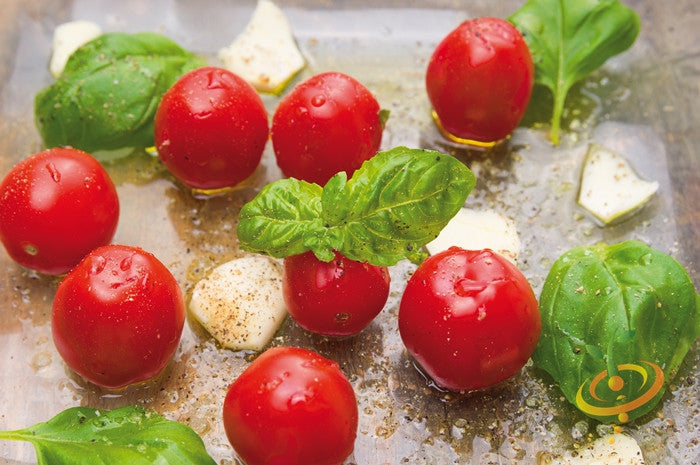 Red cherry tomato seeds from SeedsNow, small indeterminate tomato variety, shown in close-up with ripe red cherries.