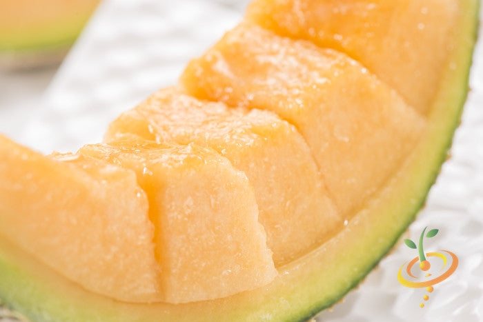 Fresh ripe cantaloupe melon from SeedsNow, showcasing vibrant orange flesh and green rind, ready for harvesting.