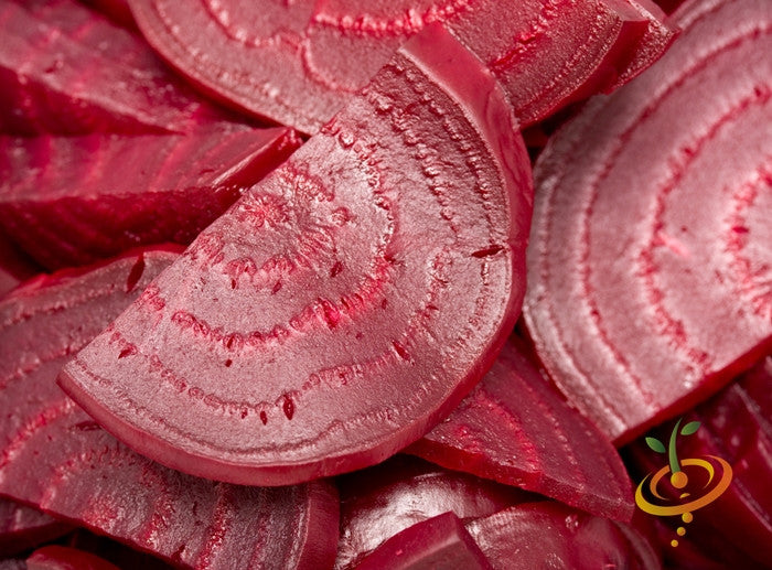 Close-up of sliced Beet Bulls Blood showing deep red concentric rings and juicy texture